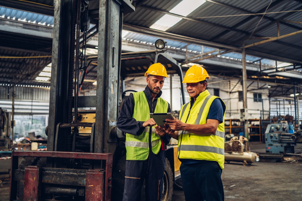 Workers Factory or Engineering work at factory site check up machine or products in site. Foreman or Technician checking Material or Machine on Plant. Heavy industry factory concept.